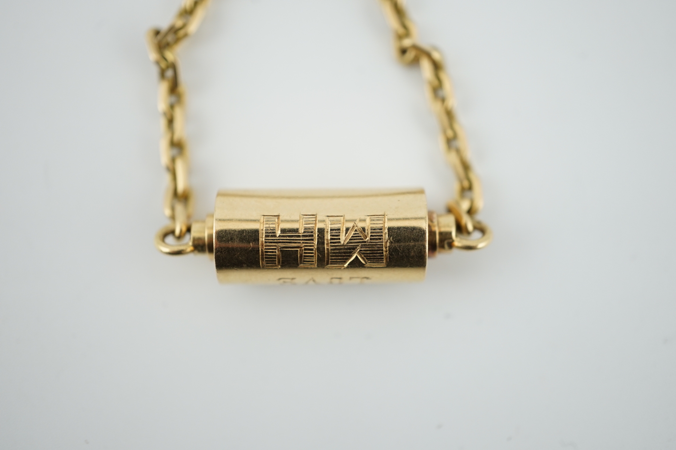 A mid to late 20th century Cartier 18ct gold barrel shaped key ring, with suspension chain